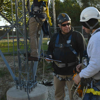 Professor Clay Sterling with students in safety equipment